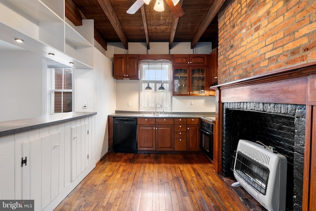 kitchen featuring black appliances, heating unit, wood ceiling, a sink, and beam ceiling
