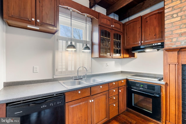 kitchen with black appliances, a sink, under cabinet range hood, beamed ceiling, and glass insert cabinets
