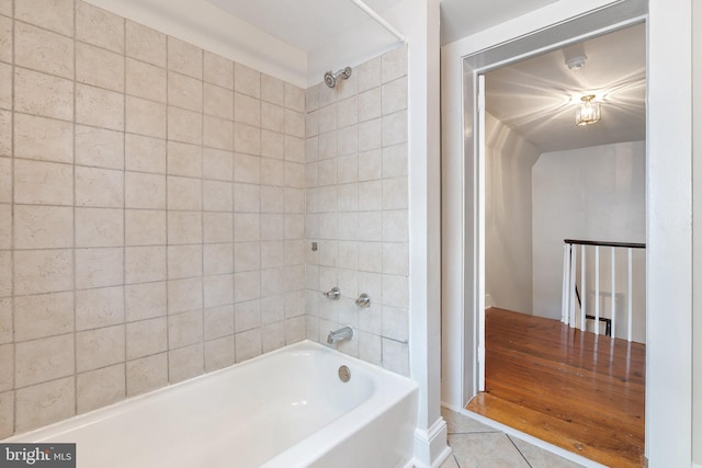 full bathroom featuring bathtub / shower combination and tile patterned flooring