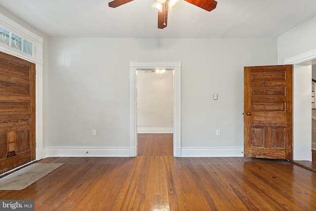entryway featuring ceiling fan, hardwood / wood-style flooring, and baseboards