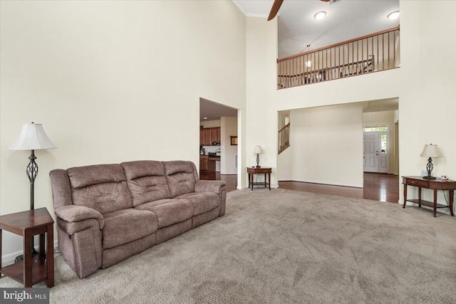 13324 John Martin Dr, Williamsport, MD 21795 - living area featuring a towering ceiling, carpet, baseboards, and a ceiling fan