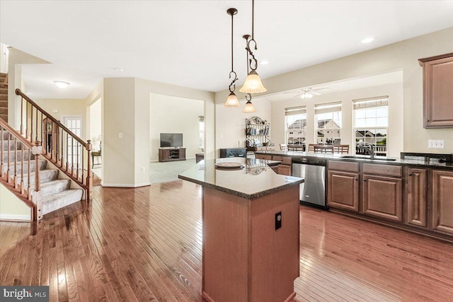 13324 John Martin Dr, Williamsport, MD 21795 - kitchen featuring a center island, dishwasher, ceiling fan, wood-type flooring, and open floor plan