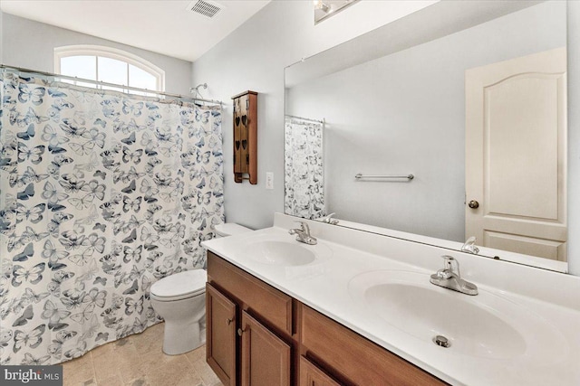 13324 John Martin Dr, Williamsport, MD 21795 - full bathroom with a sink, double vanity, toilet, and visible vents