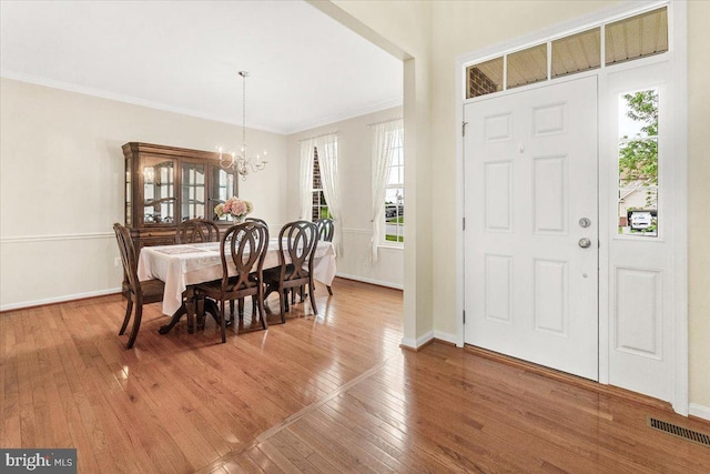 13324 John Martin Dr, Williamsport, MD 21795 - foyer with a chandelier, visible vents, plenty of natural light, and light wood-style floors