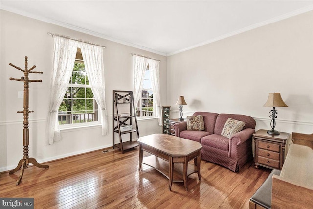 13324 John Martin Dr, Williamsport, MD 21795 - living room with ornamental molding, visible vents, baseboards, and wood-type flooring