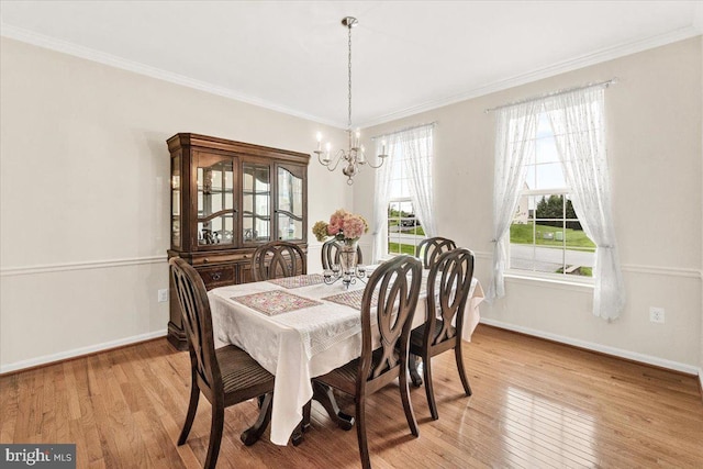 13324 John Martin Dr, Williamsport, MD 21795 - dining space with a chandelier, ornamental molding, baseboards, and light wood-type flooring
