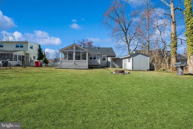 22 N Browning Ave, Somerdale, NJ 08083 - back of house with a shed, a yard, a sunroom, an outdoor structure, and roof with shingles