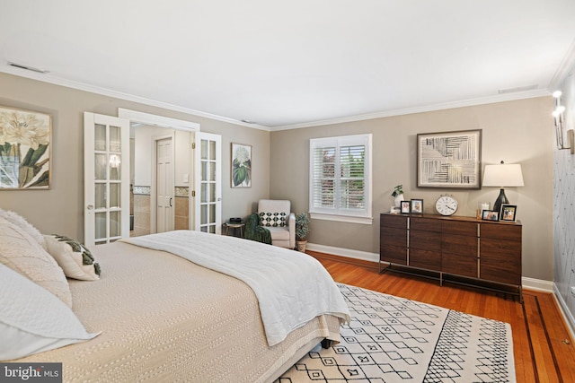 bedroom with baseboards, ornamental molding, wood finished floors, and french doors