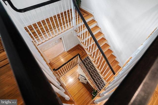 staircase with wood finished floors