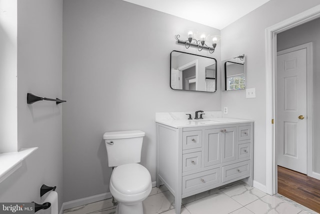 907 5th Unit B, Delaware City, DE 19706 - bathroom with vanity, toilet, baseboards, and marble finish floor