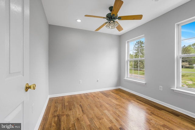 907 5th Unit B, Delaware City, DE 19706 - empty room featuring wood finished floors, baseboards, ceiling fan, and recessed lighting