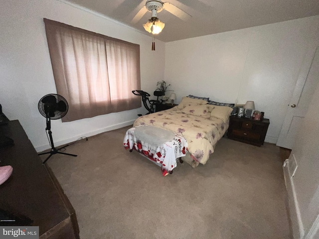 carpeted bedroom with a ceiling fan