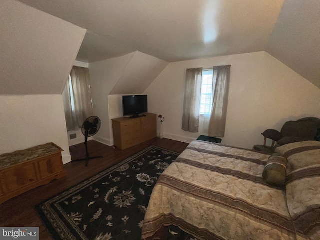 bedroom featuring vaulted ceiling and wood finished floors