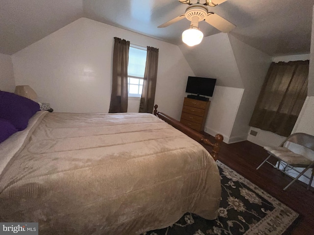 bedroom with lofted ceiling, wood finished floors, ceiling fan, and baseboards