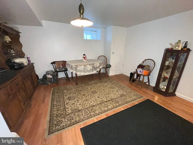 dining area with wood finished floors