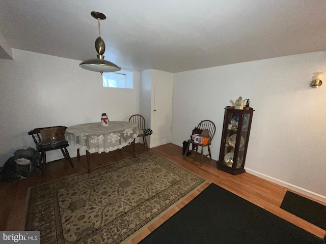 sitting room with wood finished floors and baseboards