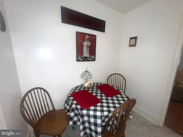 dining room featuring baseboards