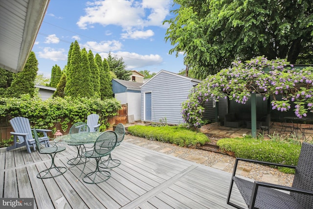 4311 Ellicott St NW, Washington, DC 20016 - wooden deck with outdoor dining area and fence