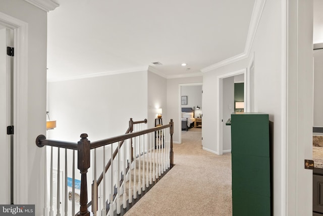 corridor with an upstairs landing, baseboards, light colored carpet, ornamental molding, and recessed lighting
