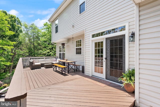wooden deck featuring outdoor lounge area and outdoor dining space