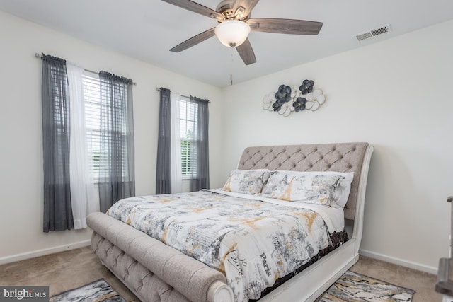 bedroom with carpet, baseboards, and ceiling fan