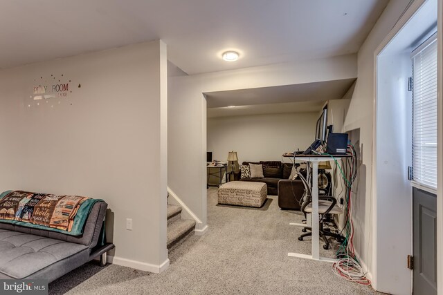 carpeted bedroom featuring baseboards