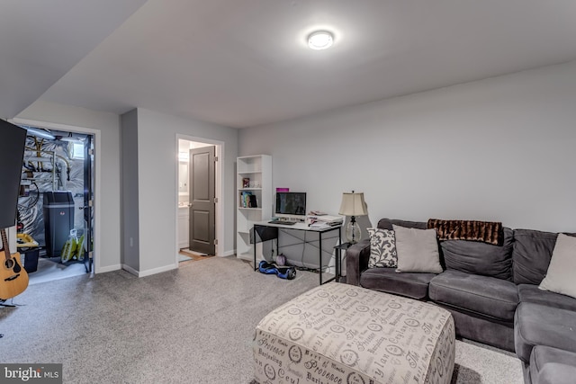 living room featuring carpet and baseboards