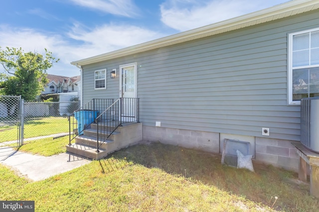 entrance to property featuring central AC unit
