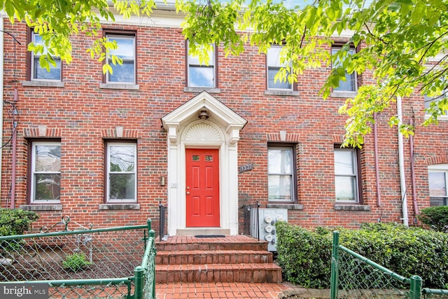 1337 Adams St NE Unit 1, Washington, DC 20018 - doorway to property featuring fence and brick siding