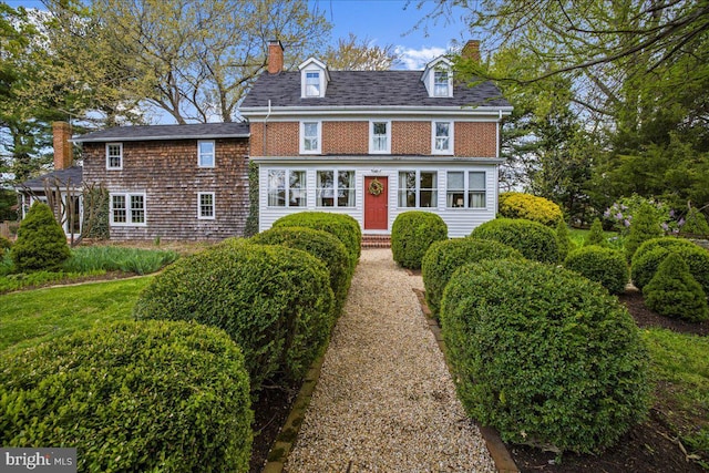view of front of home featuring a chimney