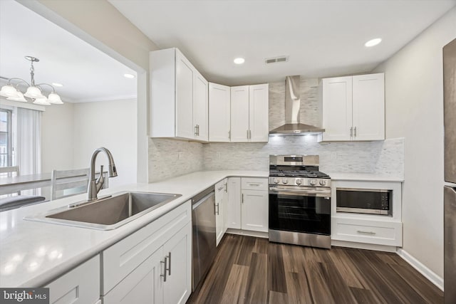 417 Jamestown Ct, Mount Laurel, NJ 08054 - kitchen with wall chimney range hood, stainless steel appliances, a sink, light countertops, and white cabinetry