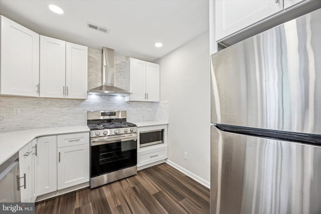 417 Jamestown Ct, Mount Laurel, NJ 08054 - kitchen featuring stainless steel appliances, wall chimney exhaust hood, dark wood-style floors, white cabinetry, and backsplash