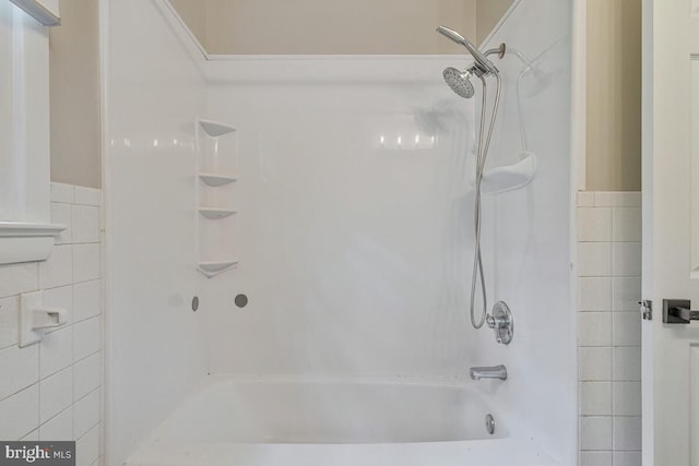 22 Hillside Ct, Huntingtown, MD 20639 - bathroom with tile walls, shower / washtub combination, and wainscoting