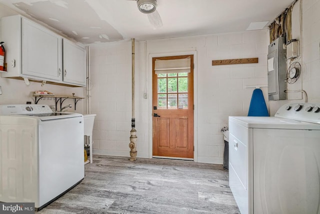 22 Hillside Ct, Huntingtown, MD 20639 - laundry area with cabinet space, separate washer and dryer, light wood-style flooring, and concrete block wall