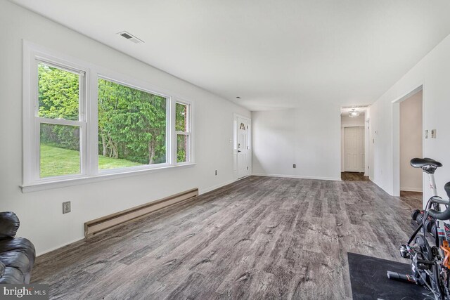 22 Hillside Ct, Huntingtown, MD 20639 - unfurnished living room with a baseboard radiator, wood finished floors, and baseboards