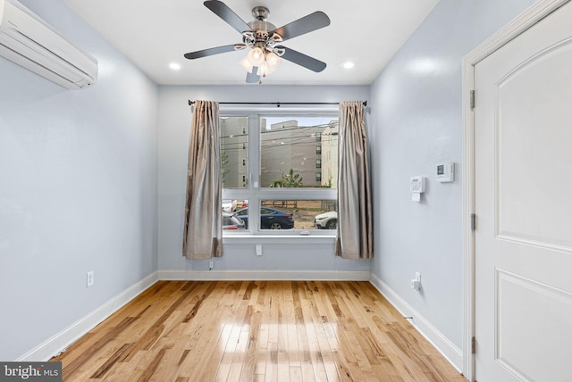 823 N 15th St Unit 1, Philadelphia, PA 19130 - empty room featuring a wall mounted air conditioner, baseboards, ceiling fan, and hardwood / wood-style flooring