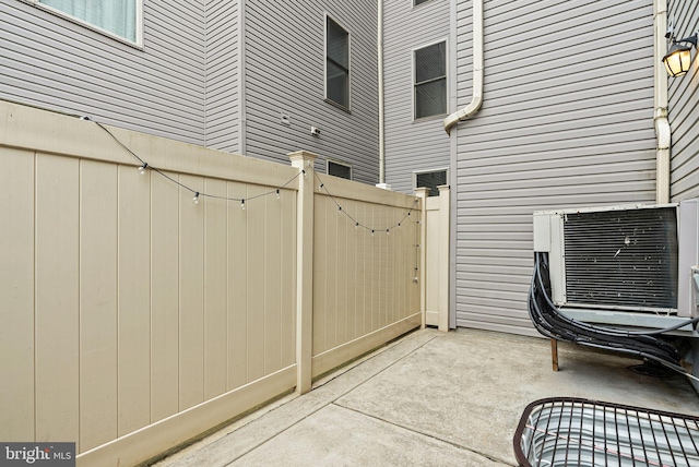 823 N 15th St Unit 1, Philadelphia, PA 19130 - view of patio with cooling unit, fence, and a gate