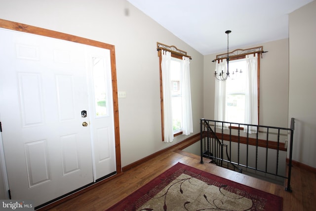 20 Fredericksville Rd, Mertztown, PA 19539 - entryway featuring a chandelier, lofted ceiling, wood finished floors, and baseboards