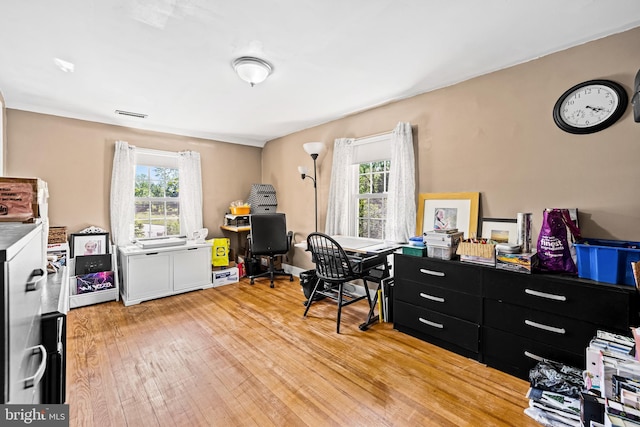 office area with light wood finished floors