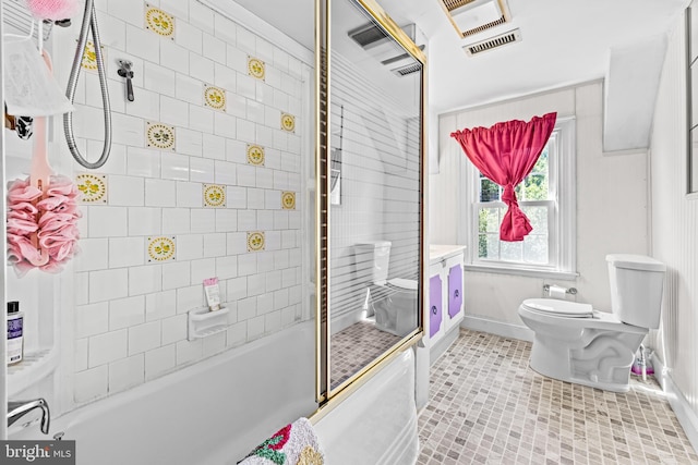 bathroom with toilet, baseboards, tile patterned flooring, and bathtub / shower combination