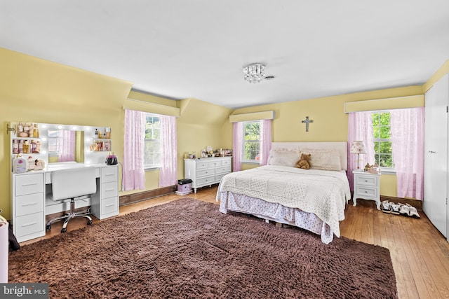 bedroom featuring a desk and hardwood / wood-style floors