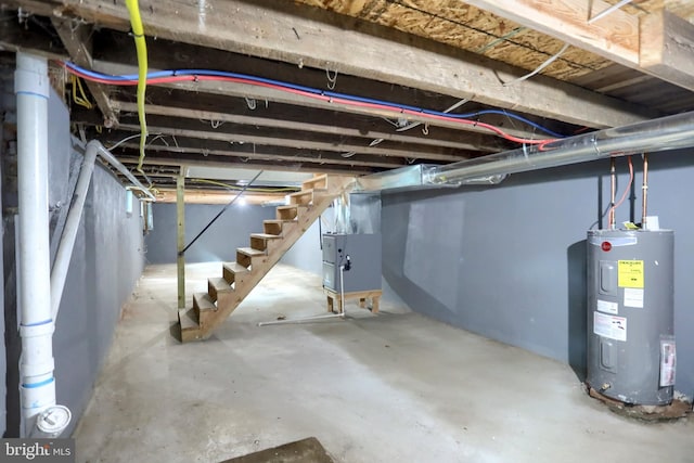 unfinished basement featuring water heater, stairs, and heating unit