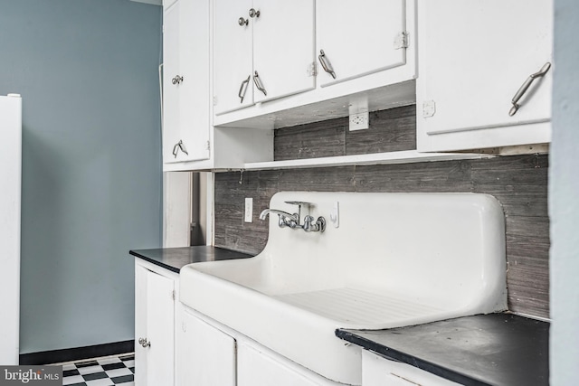 1050 Moravia St, Fountain Hill, PA 18015 - interior space featuring a sink, open shelves, white cabinetry, and tile patterned floors