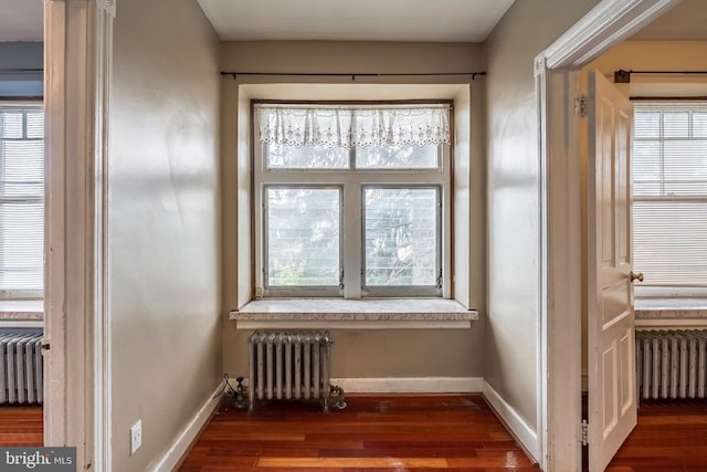 1050 Moravia St, Fountain Hill, PA 18015 - room details featuring wood finished floors, baseboards, and radiator heating unit