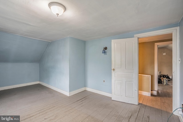 1050 Moravia St, Fountain Hill, PA 18015 - bonus room with lofted ceiling, wood-type flooring, and baseboards