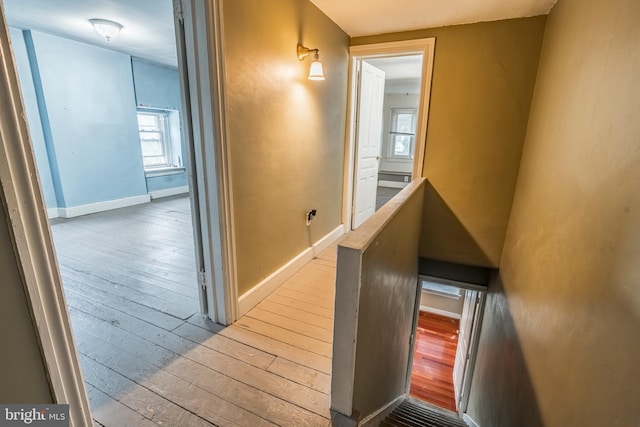1050 Moravia St, Fountain Hill, PA 18015 - corridor with baseboards, a healthy amount of sunlight, hardwood / wood-style floors, and an upstairs landing