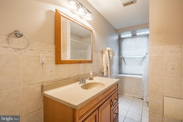 1050 Moravia St, Fountain Hill, PA 18015 - bathroom with tile walls, curtained shower, visible vents, tile patterned flooring, and vanity