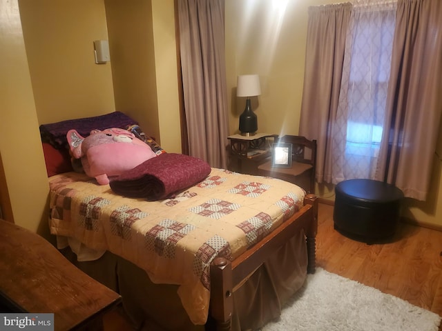 bedroom featuring wood finished floors