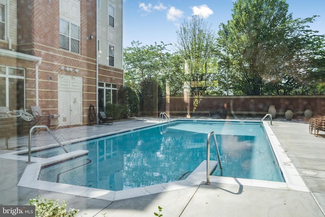 view of pool with fence and a fenced in pool