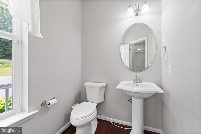 4111 Bayside Rd, Chesapeake Beach, MD 20732 - bathroom with wood finished floors, healthy amount of natural light, toilet, and baseboards